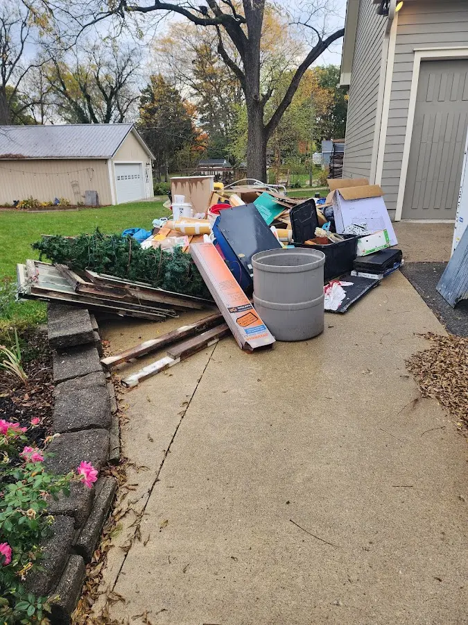 Dumpster being loaded with debris for Roofing Dumpster Rental in Mono Vista